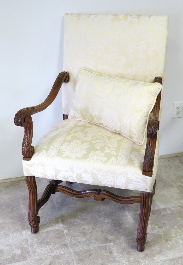 A French Walnut Louis XV Carved Throne Style Armchair w/Ivory Upholstery: A very stylish French Louis XV style carved walnut throne chair or armchair with extensive acanthus carvings to arms & legs. Ivory on satin floral upholstery, 44" height at back, 26" wide at arms, 24"