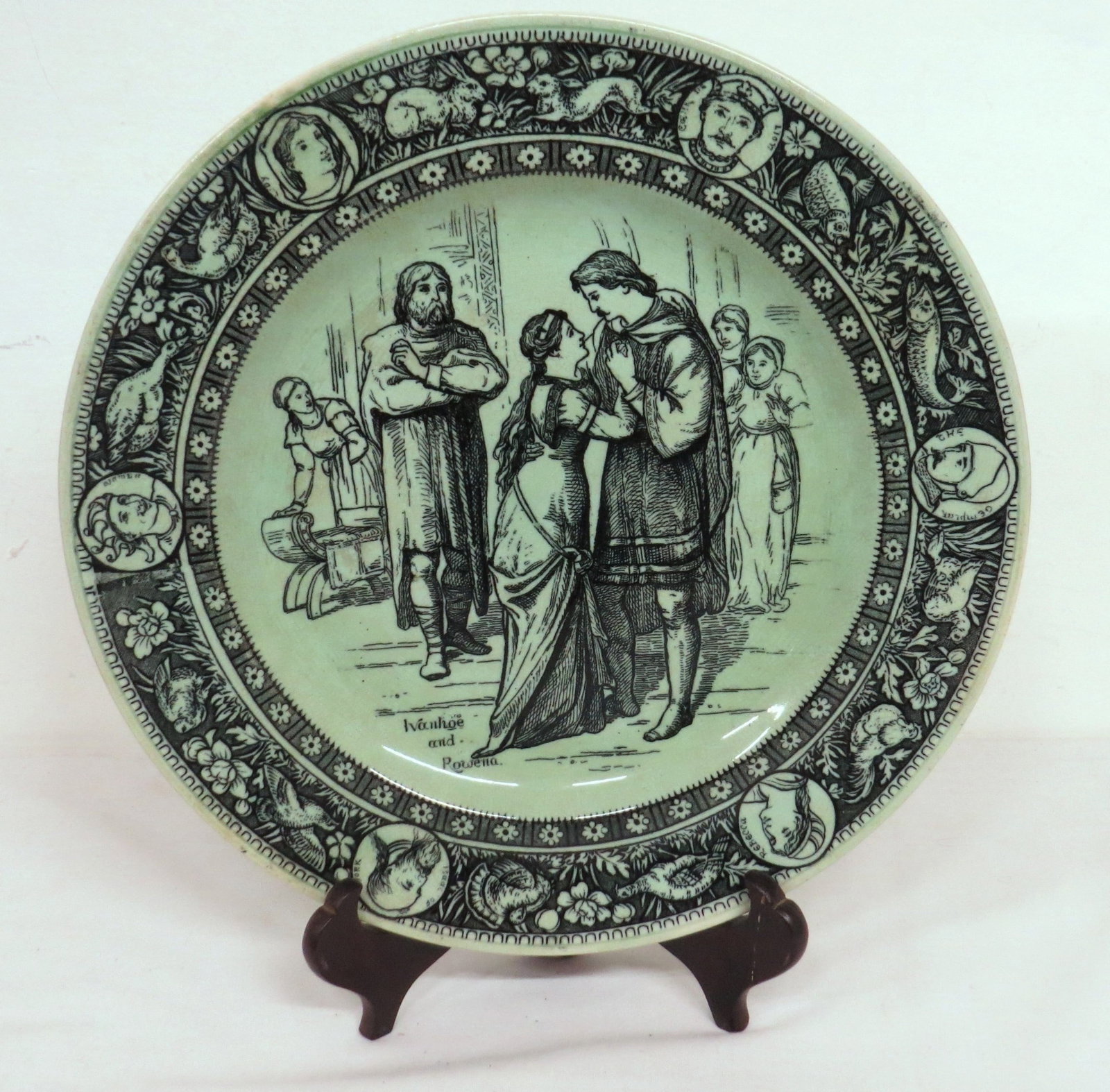 c.1905 Wedgwood Ivanhoe & Rowena Plate Rare Green Color: A rare coloring for this early 20th C. Wedgwood plate depicting Ivanhoe and Rowena, 10.25" diameter, no damage. Note - This lot can be shipped in-house, you do not have to use the LiveShipping program