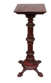 A Victorian Carved Mahogany Pedestal With Carved Feet