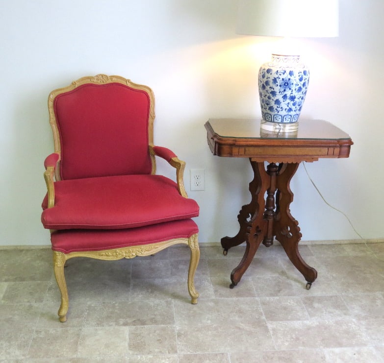 A Louis the XV Style Tuscan Red Chair: A Mid Century Louis XV style Fauteiul Chair w/matching zip out cushion for extra comfort. Cabriole leg form, perfect bedroom dressing chair or corner chair, light pecan gold carved finish. Measures 38