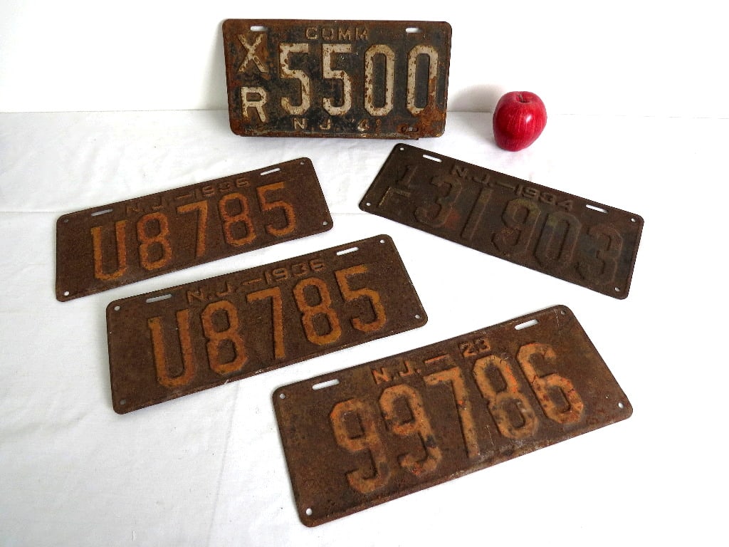 A Grouping of 1930's New Jersey License Plates: A grouping of New Jersey license plates from the 1930's including a Commercial plate, a matched pair, and others. Restore or decorate just as they are.