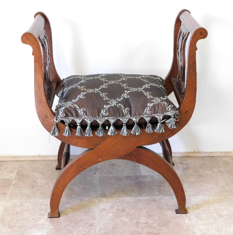 A French Dagobert Curule Chair: A French Dagobert Curule Chair, 31" height, 27" wide, 17.5" depth with beaded cushion.