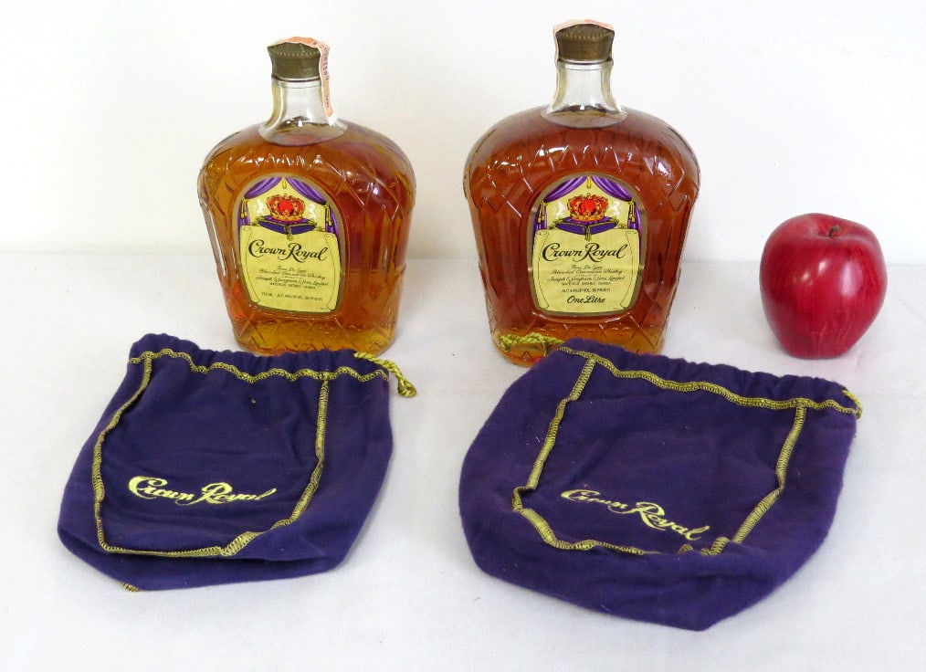 Two Sealed Bottles Crown Royal 1980 & 1981 w/Bags: Estate found, two unopened bottles Canadian Crown Royal dated 1980 & 1981 with bags.