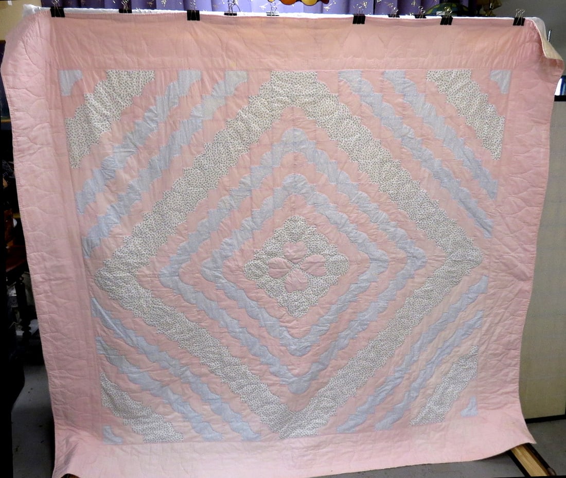 Hand Stitched Diamonds and Hearts Quilt: A hand stitched large quilt in colors of soft pinks and blues featuring a cascading diamonds with center hearts pattern, measuring 96" x 87" in size, good shape