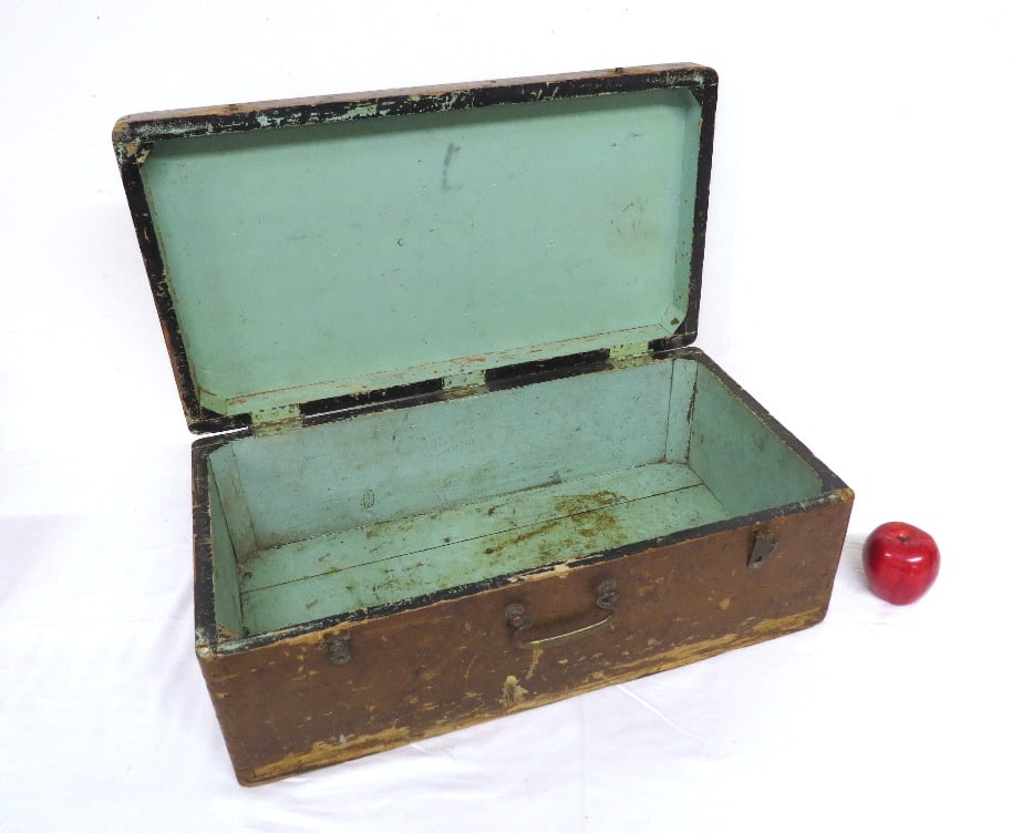 19th C. Antique Travel Trunk with Blue Paint Interior: A rectangular form 19th C. travel trunk with dovetail corner construction and square nails with a pale blue milk paint interior, measuring 24" wide by 13" deep and 9" height closed.