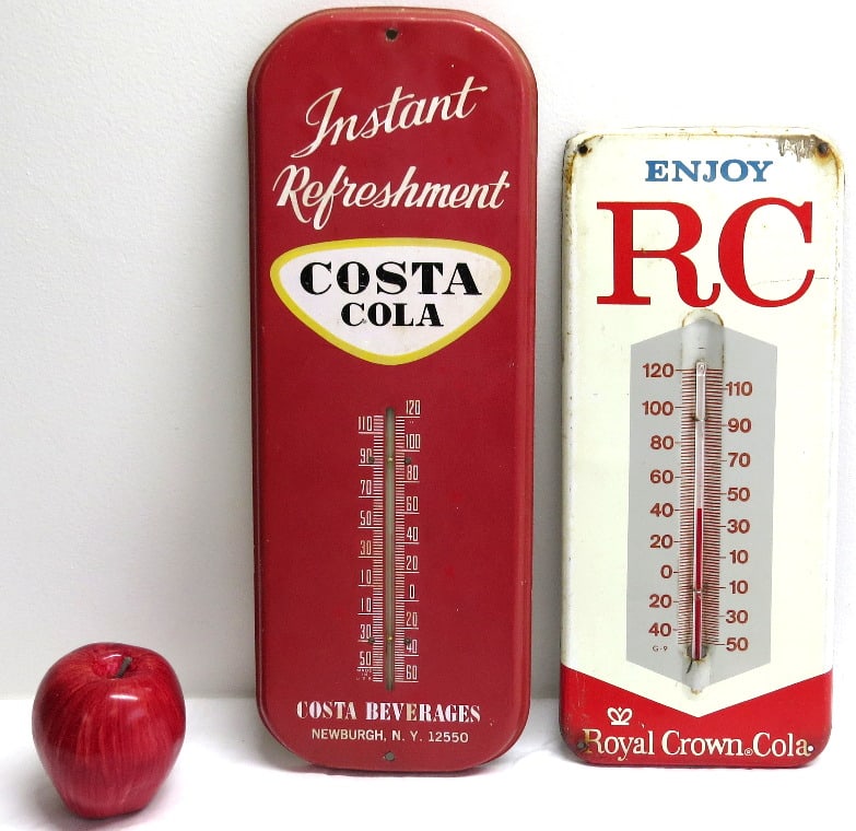 Two Advertising Soda Thermometers - RC Cola and Costa Cola: Two vintage advertising soda thermometers, both with intact glass, first being RC Cola, second being Costa Cola out of Newburgh, NY. Costa 15.75" by 6" in size and RC 13.5" by 5.75".