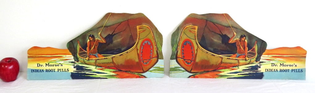 Dr. Morse's Indian Root Pills Left/Right Countertop Display Signs: Two early 20th C. heavy cardboard color lithographed countertop or window signs for Dr. Morses Indian Root Pills, each 19.5" x 9.5" in size. Folding cardboard stand on reverse has never even been fold