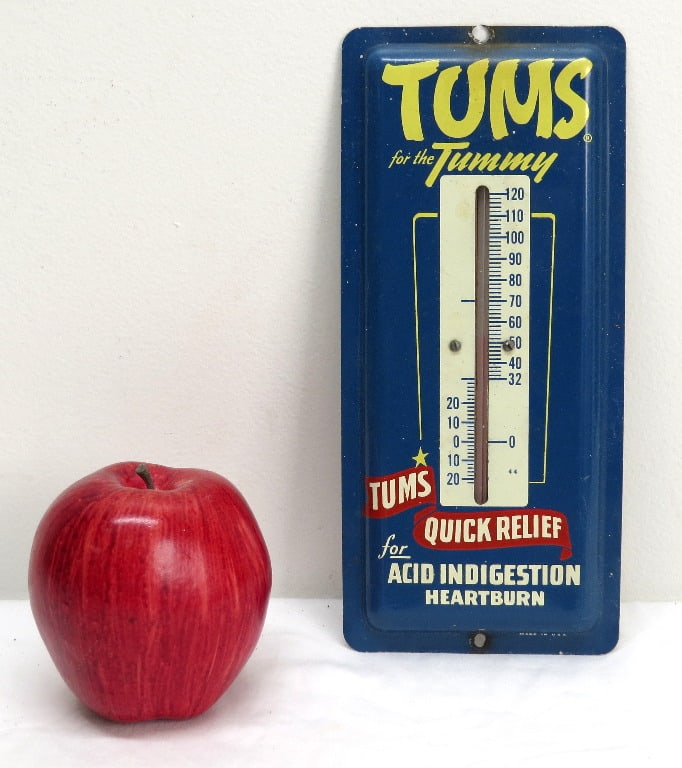 Vintage TUMS Antacid Advertising Thermometer: A colorful medicinal advertising thermometer for TUMS Antacids with intact glass, measuring 9" x 4" in size