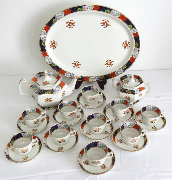 Enoch Wood & Sons Woods Ware Ogontz China: A partial set of Enoch Wood & Son's Woods Ware China in the Ogontz pattern, consisting of the platter 16" x 12.5", a teapot, covered sugar bowl, and 10 cups/saucers. All appear to be in good shape.