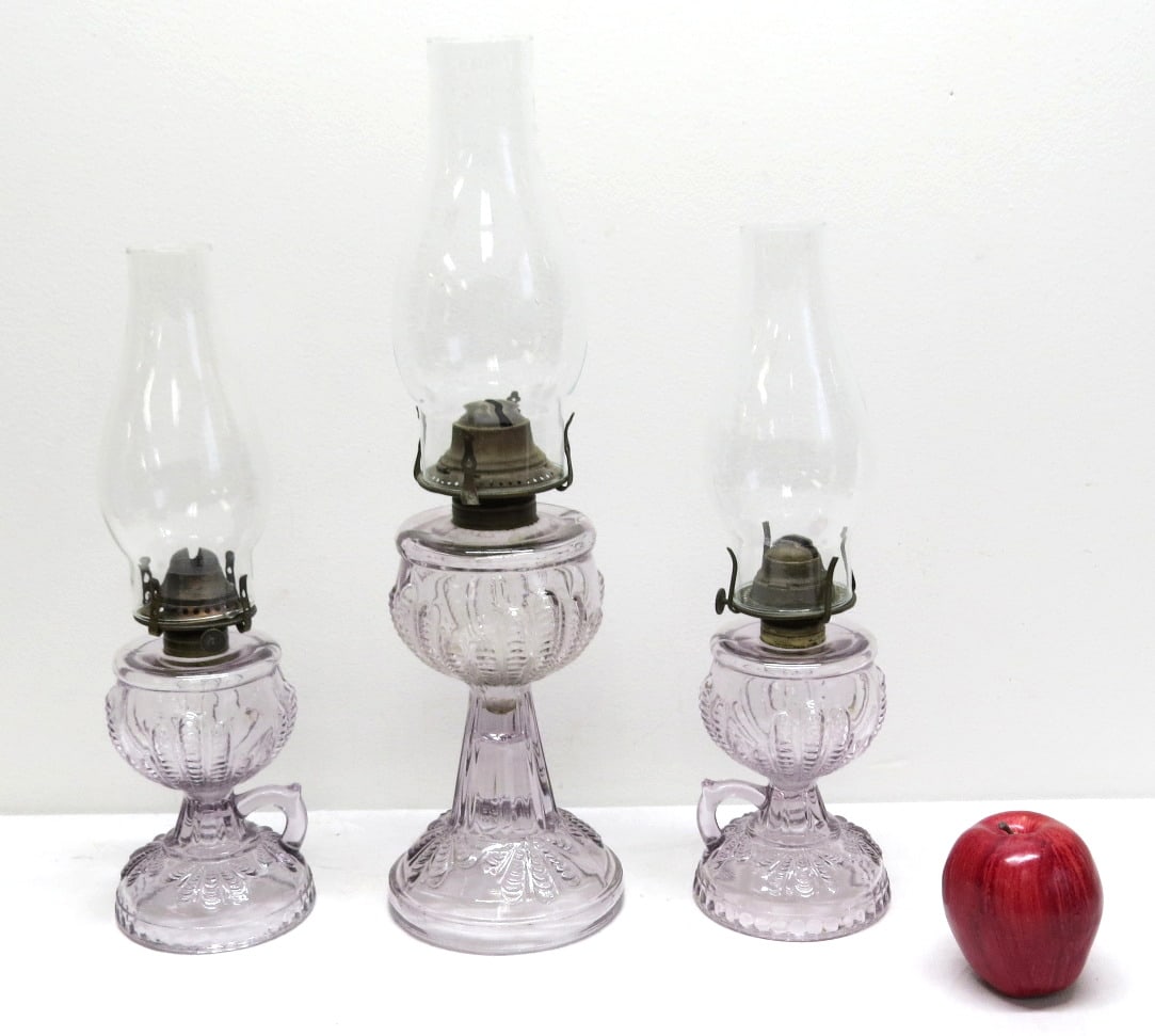 A Trio of US Glass "Turkey Foot" or "Plume" Sun Colored Amethyst Oil Lamps (1 of 8)
