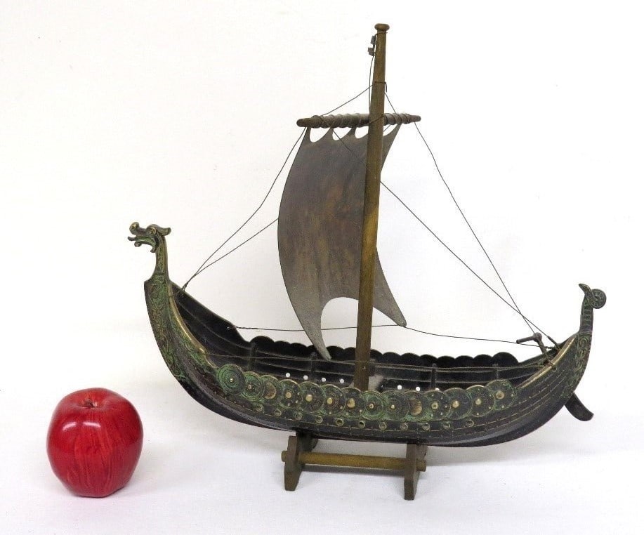 MCM Edward Aagaard Danish Bronze Viking Ship Model: A bronze of a Viking ship with sail by Danish designer Edward Aagaard, on its wooden stand. Ship is approx 16" in overall length and a height of 15" to mast top.