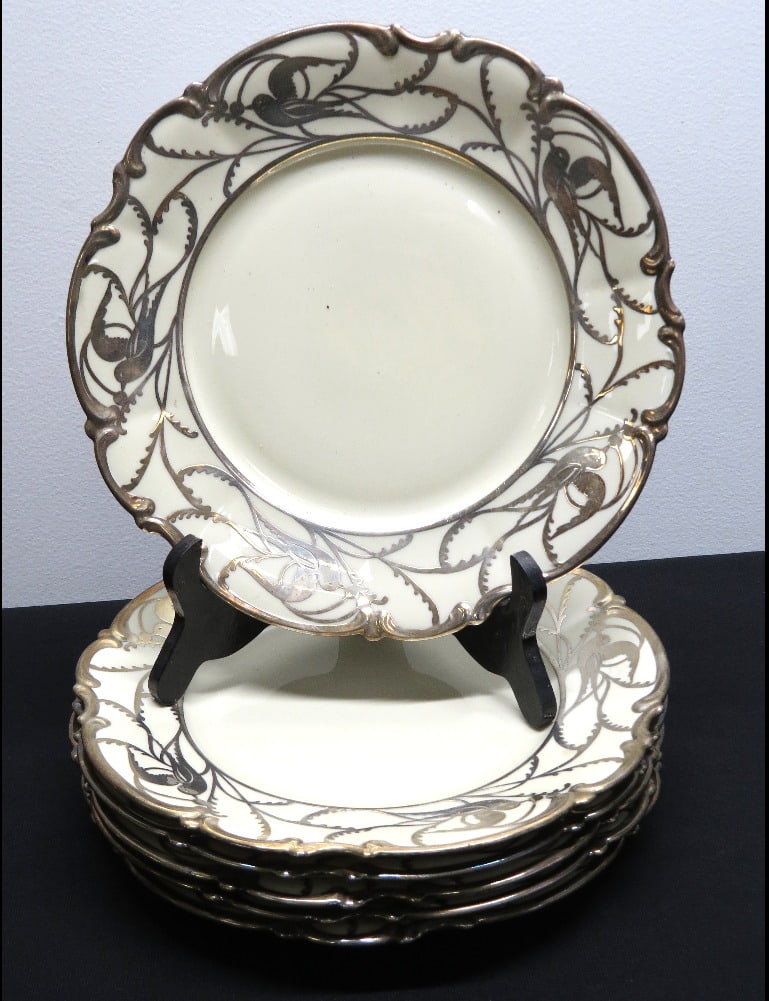 Six Hutschenreuther Selb Bavaria Sterling Peace Dove Overlay Dinner Plates: A Group of 6 Hutschenreuther Selb Bavarian Made Porcelain Dinner Plates in Ivory with Sterling Silver Peace Dove Overlay, each 10.75" in size, some tarnish but all in good shape otherwise
