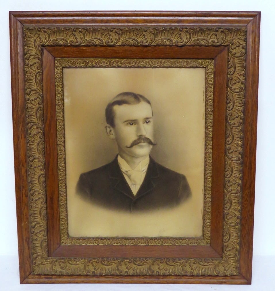 19th C. Oak Framed Portrait of a Gentleman w/Handlebar Mustache: An instant relative in this 19th C. hand colored portrait of a gentleman set in a fantastic oak frame measuring 27" by 31" in size. Inner frame dimensions 17.75" by 20.75" rabbet of 3/8 of an inch