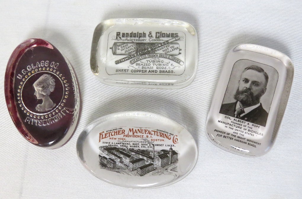 Four late 19th C. Advertising Paperweights: Four late 19th C. Advertising paperweights include Randolph & Clowes Boilers, Steam Pipe, etc. from Waterbury Ct (flat flake on edge), Fletcher Manufacturing Co. of Providence, RI makers of Stove/Lamp