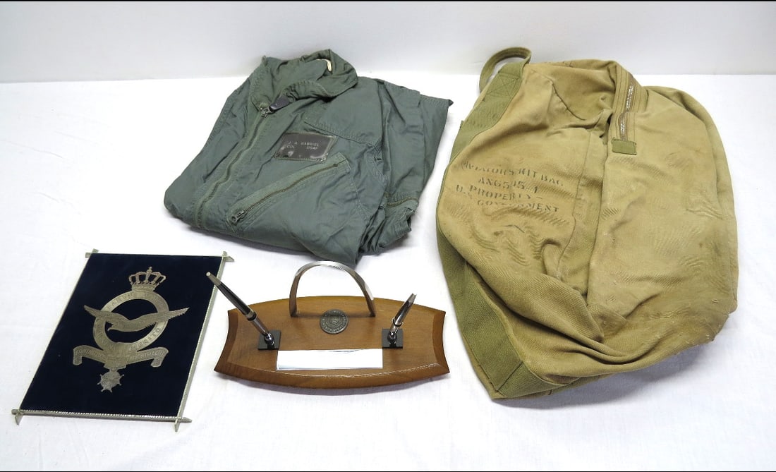 Cold War Era Air Force Colonel's Memorabilia: From the personal effects of a WWII into Cold War Era Air Force Colonel (at retirement) including his flight suit, parachute/kit bag, memorial plaque of a visit by the Royal Netherland's Air Force to