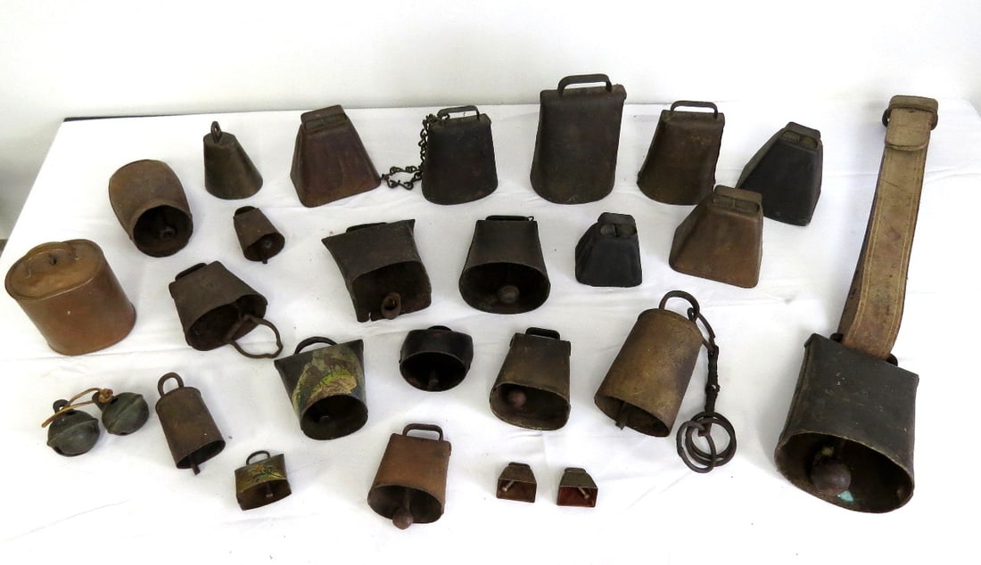 A Collection of Old Sheet Iron & Some Brass/Copper Cowbells and Livestock Bells: A nice grouping of old primarily cast sheet iron/riveted cowbells and livestock bells, right off of an old Dutchess county farm. A few more modern era bells, one in copper/signed, but many sheet iron/