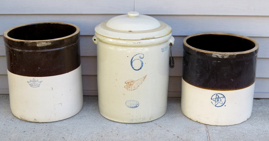 Three Country Stoneware Crocks Including Red Wing: Three country crocks including an 6 gallon Redwing w/lid, and two press molded brown & white examples in 4 & 6 gallon size w/stenciled capacity markers. All in good shape, the Red Wing is missing one