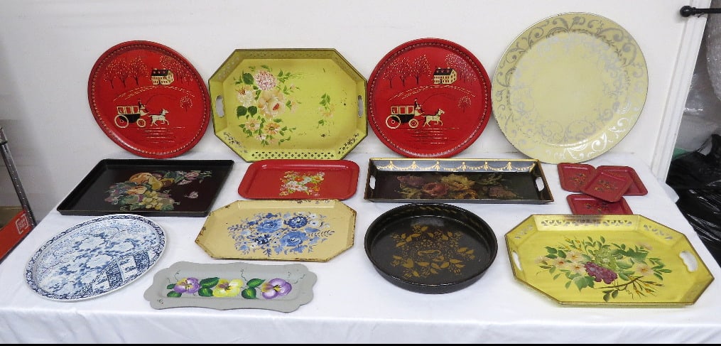 A Collection of Tole Trays in Various Shapes & Sizes: A large tabletop assortment of primarily tole trays in various shapes & sizes. Some paint wear but all display well.