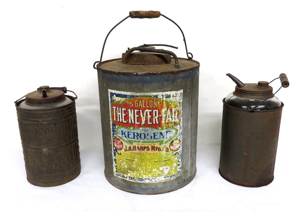 A Trio of Tin Jacketed 19th C. Kerosene Oil Jugs & Kerosene Can: A trio of tin jacketed 19th C. one gallon kerosene oil / lamp oil jugs, one is a Diamond Oil Can with 1883 Patent Date, the other is a Dandy. Pour lip on the Dandy a little rough, otherwise both in go