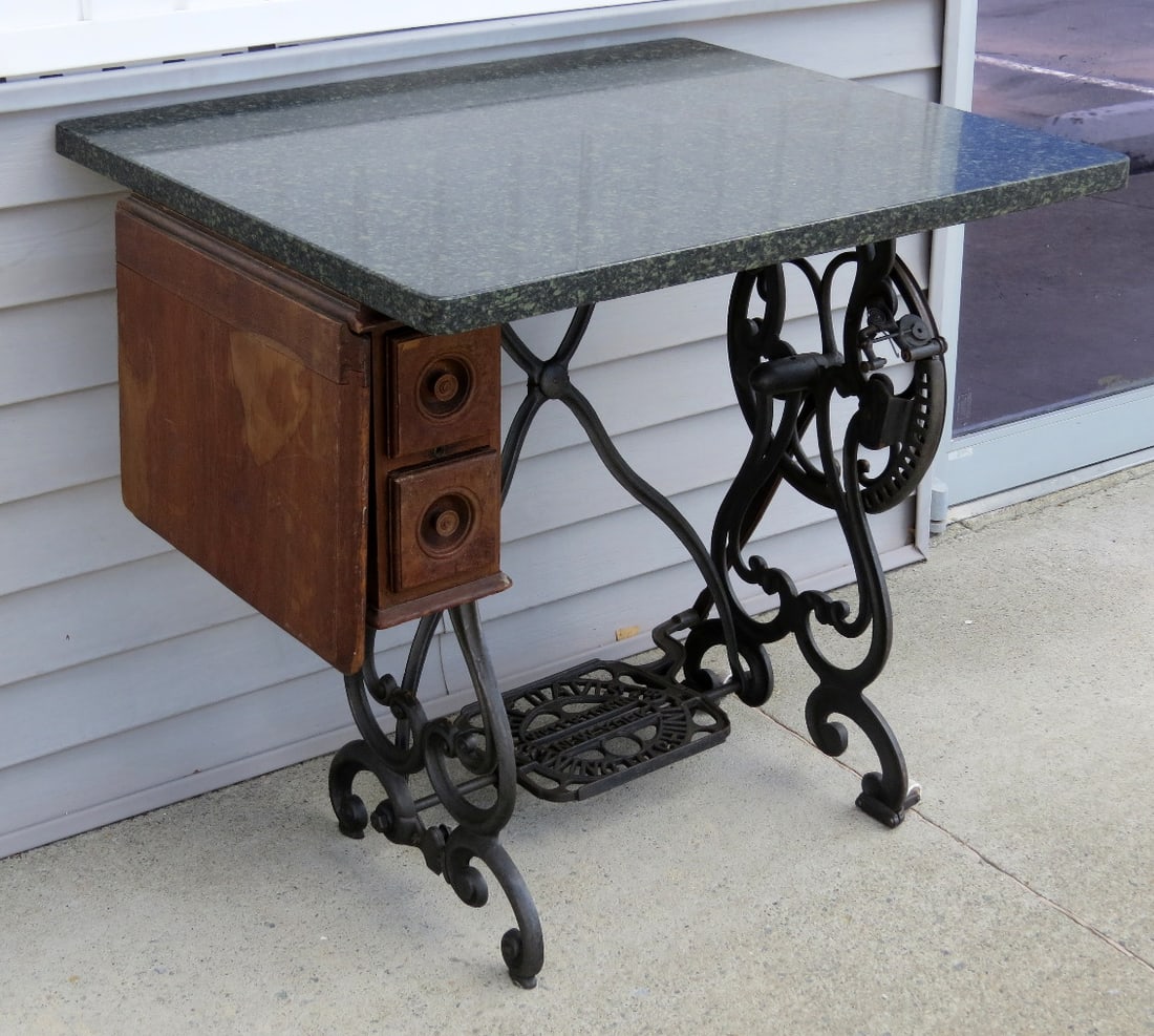 Green Granite Topped Davis Wing Sewing Machine Table: One of the nicest treadle sewing machine bases we've yet seen is this Davis Wing Machine example from Watertown, NY. Topped with a piece of green & black countertop granite, clearly a marriage but it
