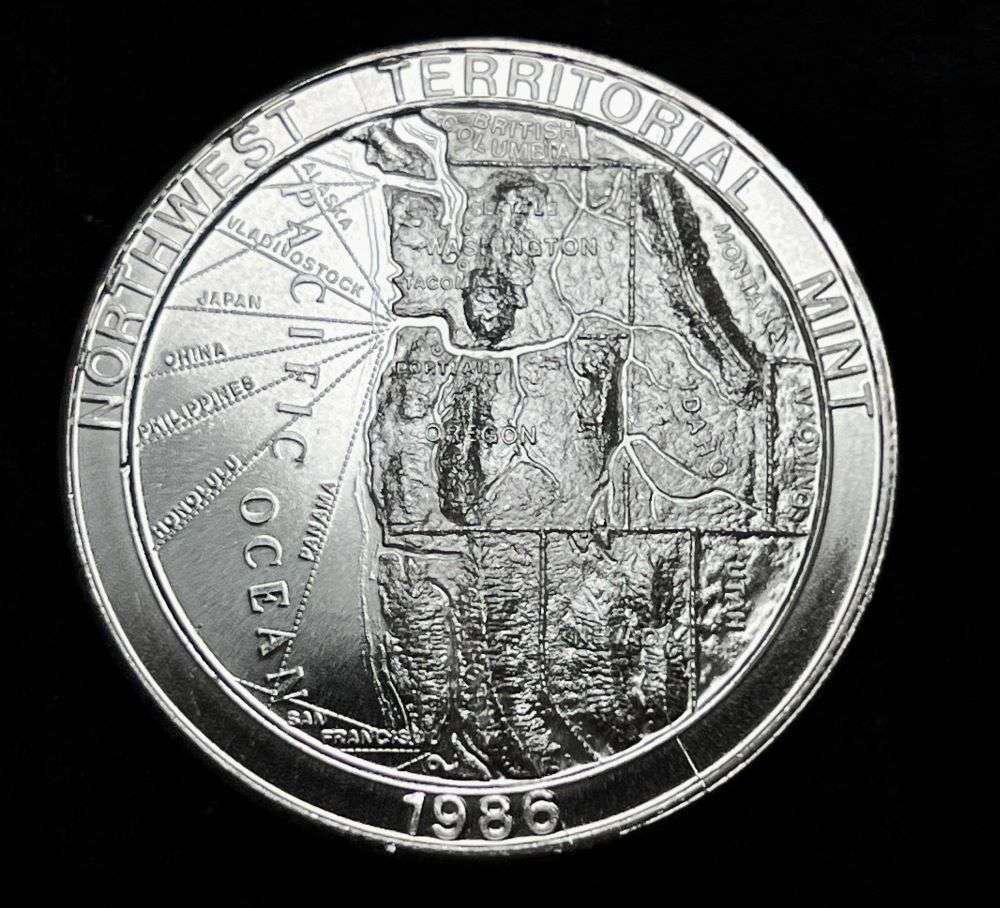 Extremely Rare Vintage 1986 NWTM 1 ozt .999 Silver: I have never seen or heard of these 1986 rounds before. It is quite interesting if you type in the name "Ross Hanson" into Google. Winner shall receive (1) coin precisely resembling the one shown here