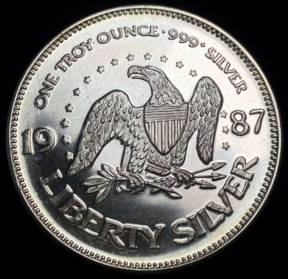 1987 A-Mark "Life Liberty Happiness" Proof 1 ozt .999 Silver: Winner shall receive the exact coin shown here. (RR/B)