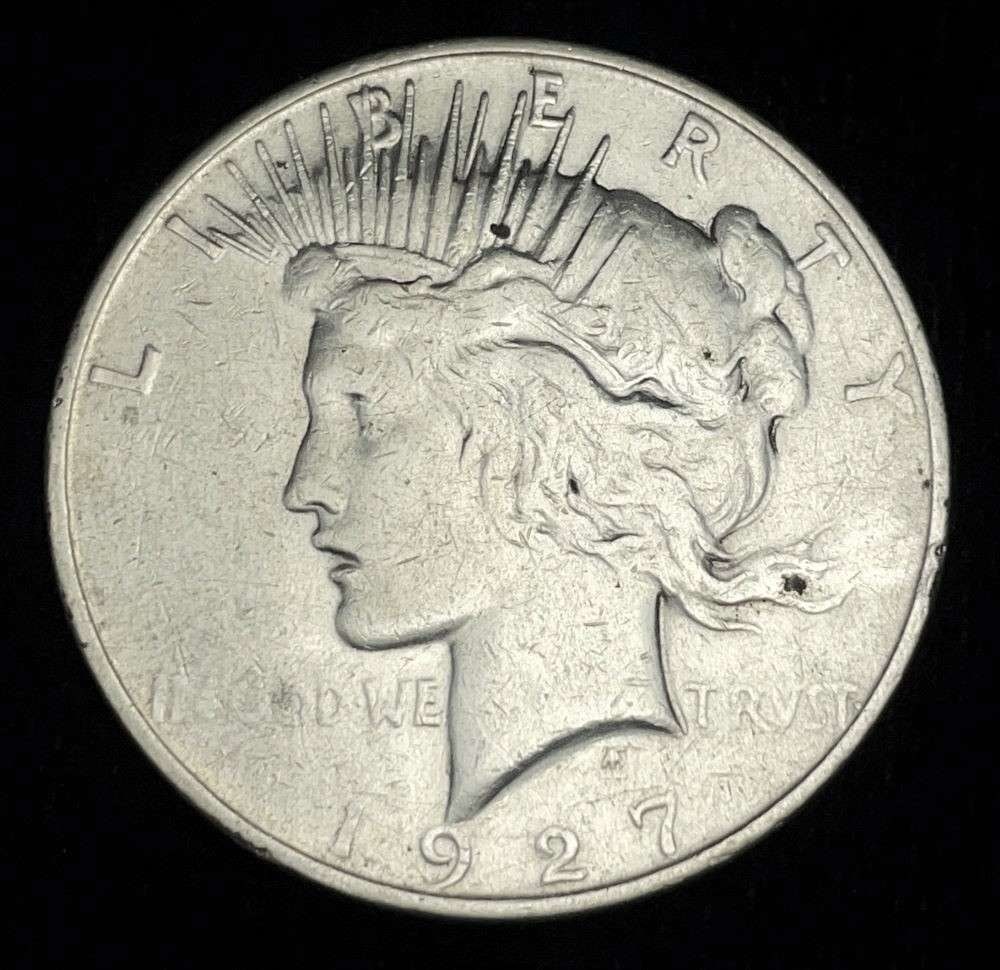 1927-D Peace Silver Dollar AU: Winner shall receive the exact coin shown here. (JM/B)