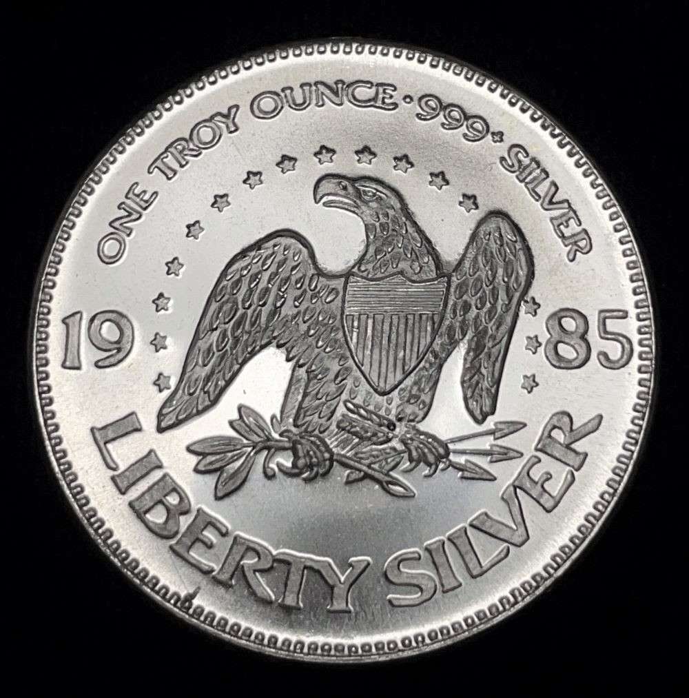 1985 A-Mark "Life Liberty Happiness" 1 ozt .999 Silver: Winner shall receive the exact coin shown here. (JM/B)