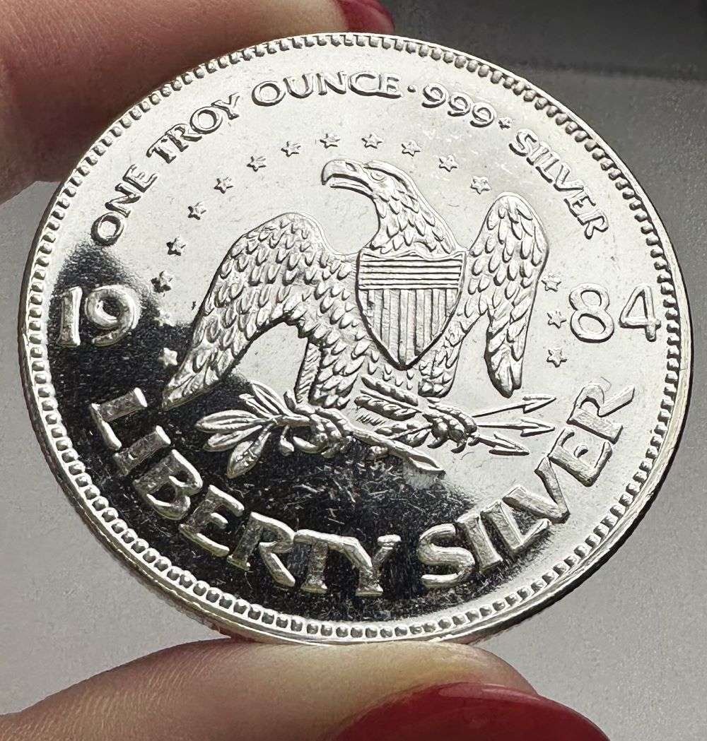 1984 A-Mark "Life Liberty Happiness" Proof 1 ozt .999 Silver: Winner shall receive the exact coin shown here. (RR/B)