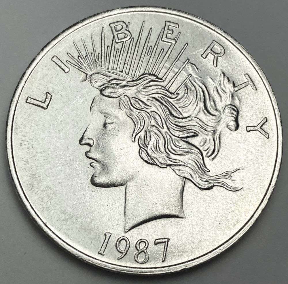 Rare 1987 Peace Dollar Design 1 ozt .999 Silver Trade Unit: Winner shall receive (1) coin precisely resembling the one shown here. (RR/B)