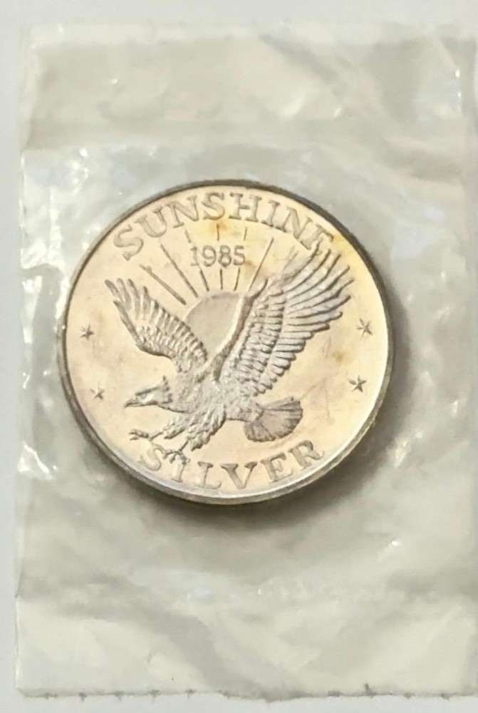 1985 Sunshine Mining 1 ozt .999 Silver: Mr. Larry recently came into our coin shop and sold us some of these beautiful 1 oz Sunshine silver rounds. Now retired, he once worked as a power line survey inspector for the Bonneville Power