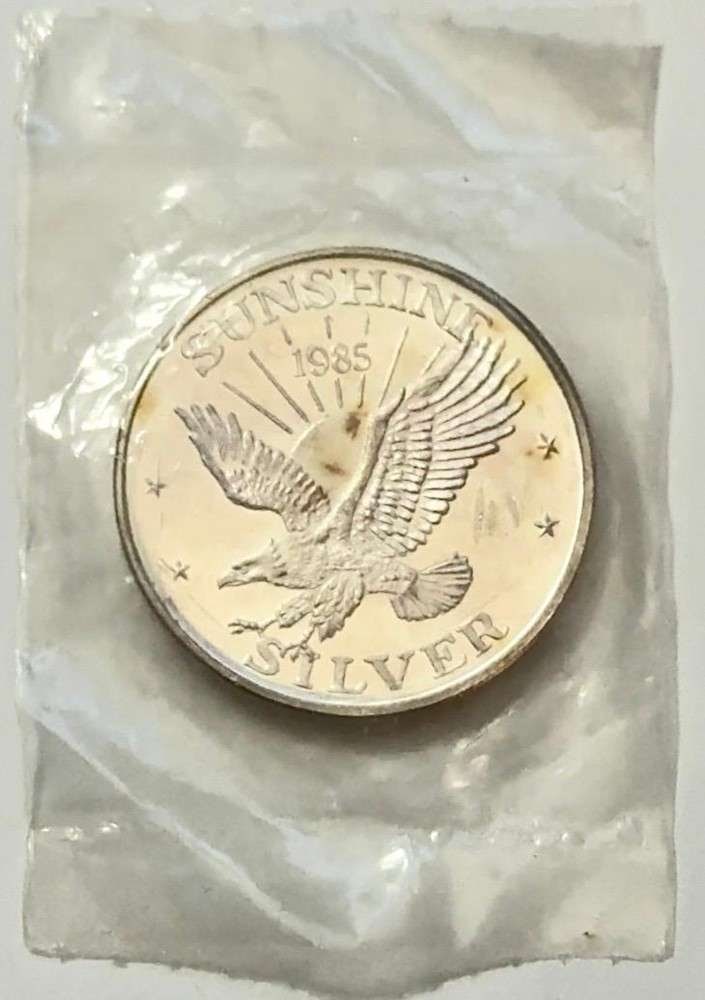 Toned 1985 Sunshine Mining 1 ozt .999 Silver (1 of 3)