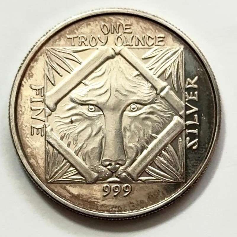 Toned Wolf/ Panda Eating Bamboo 1 ozt .999 Silver: Winner shall receive the exact round shown here. (SJ/FT)
