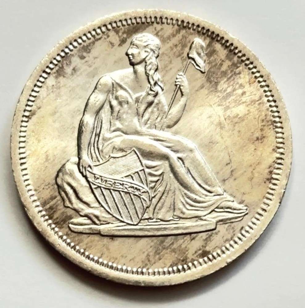 Toned Seated Liberty Design 1 ozt .999 Silver: Winner shall receive the exact round shown here. (SJ/FT)