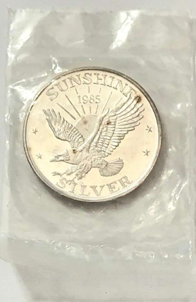 1985 Toned Sunshine Mining 1 ozt .999 Silver: Mr. Larry recently came into our coin shop and sold us some of these beautiful 1 oz Sunshine silver rounds. Now retired, he once worked as a power line survey inspector for the Bonneville Power Admini