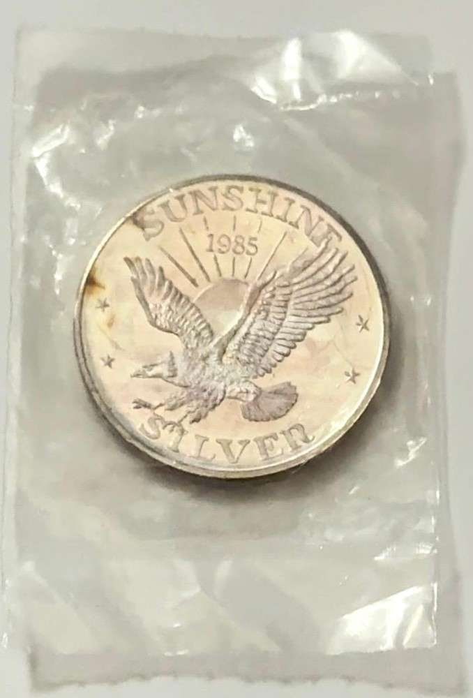 1985 Toned Sunshine Mining 1 ozt .999 Silver: Mr. Larry recently came into our coin shop and sold us some of these beautiful 1 oz Sunshine silver rounds. Now retired, he once worked as a power line survey inspector for the Bonneville Power