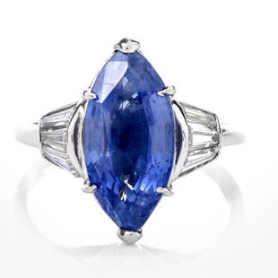 Burma No Heat Sapphire AGL Diamond Platinum Marquise Ring: Centered with a dazzling 6.58 carat natural Burma Sapphire, prong set. It is adorned to the sides with 6 genuine tapered baguette cut Diamonds of an approximate carat weight of 0.75 carats, VS1-VS2