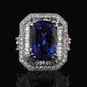 One electronically tested 18KT white gold ladies cast tanzanite and diamond ring. The featured First Image