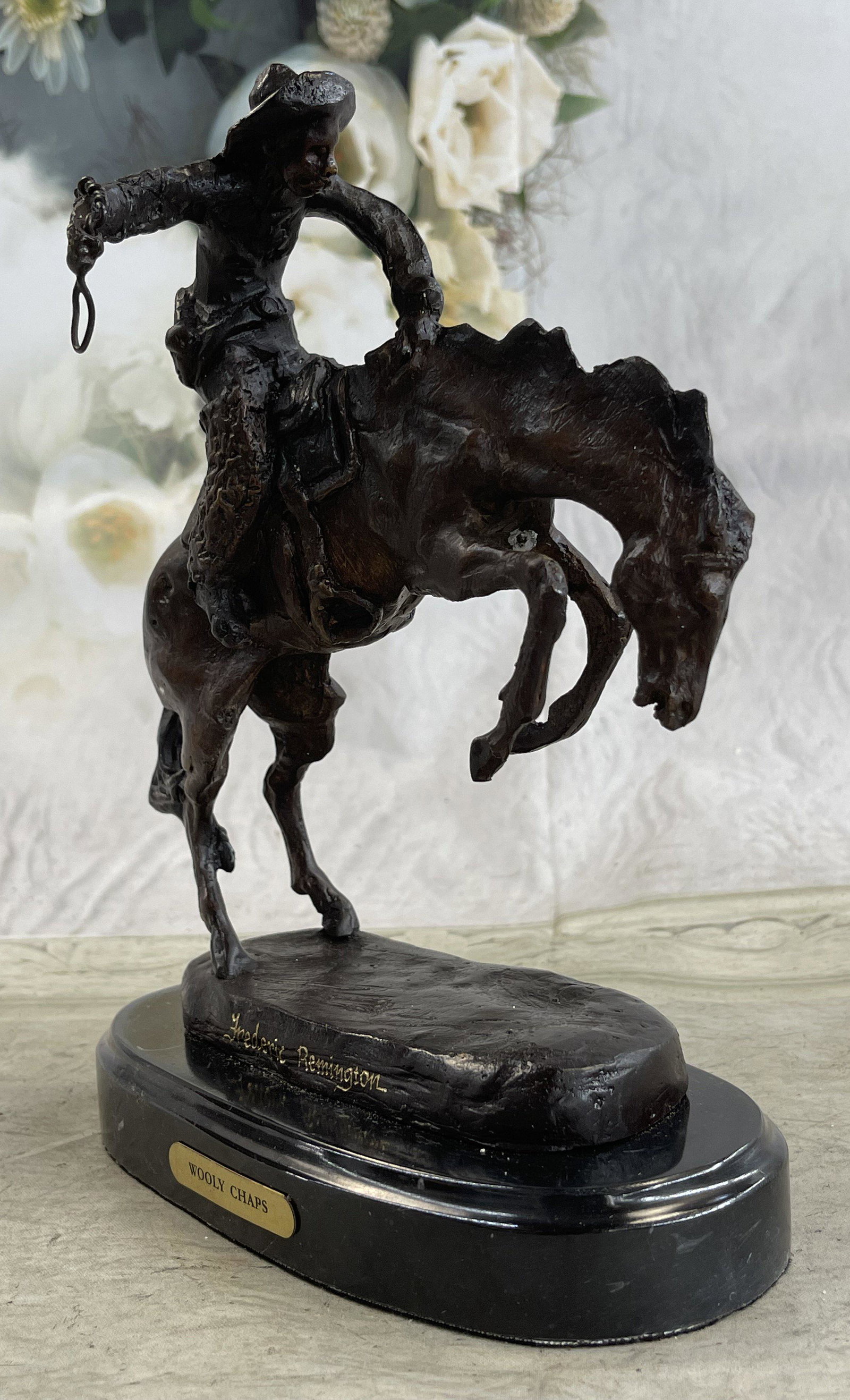 FREDERIC REMINGTON HOT CAST COWBOY FIGURINE: Dimensions: Height 10'' x Width 11''Approximate Weight: 7 LBS