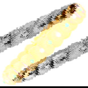 Van Cleef & Arpels Vintage Diamond Emerald 18K VCA Gold Bracelet: Bracelet. This French VCA emerald and diamond bracelet hosts shell motif designs with round cut diamonds and emeralds alternating throughout. The diamonds are of 0.85 carats, E-F in color, and VVSclar