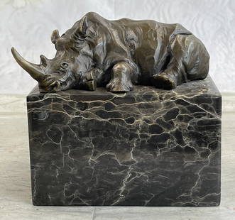 Rhino Bookend Bronze Sculpture: Bronze Dimensions with Marble Base: Height 5.5" x Width 6"Marble Dimensions: 5" X 3"Height without base: 2 1/2"Weight : 7 LBSOriginal or Reproduction: Original