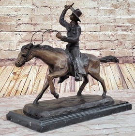 C.M Russel Cowboy riding Bronze Sculpture