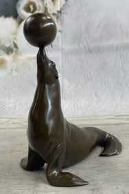 Seal Playing with Bronze Sculpture