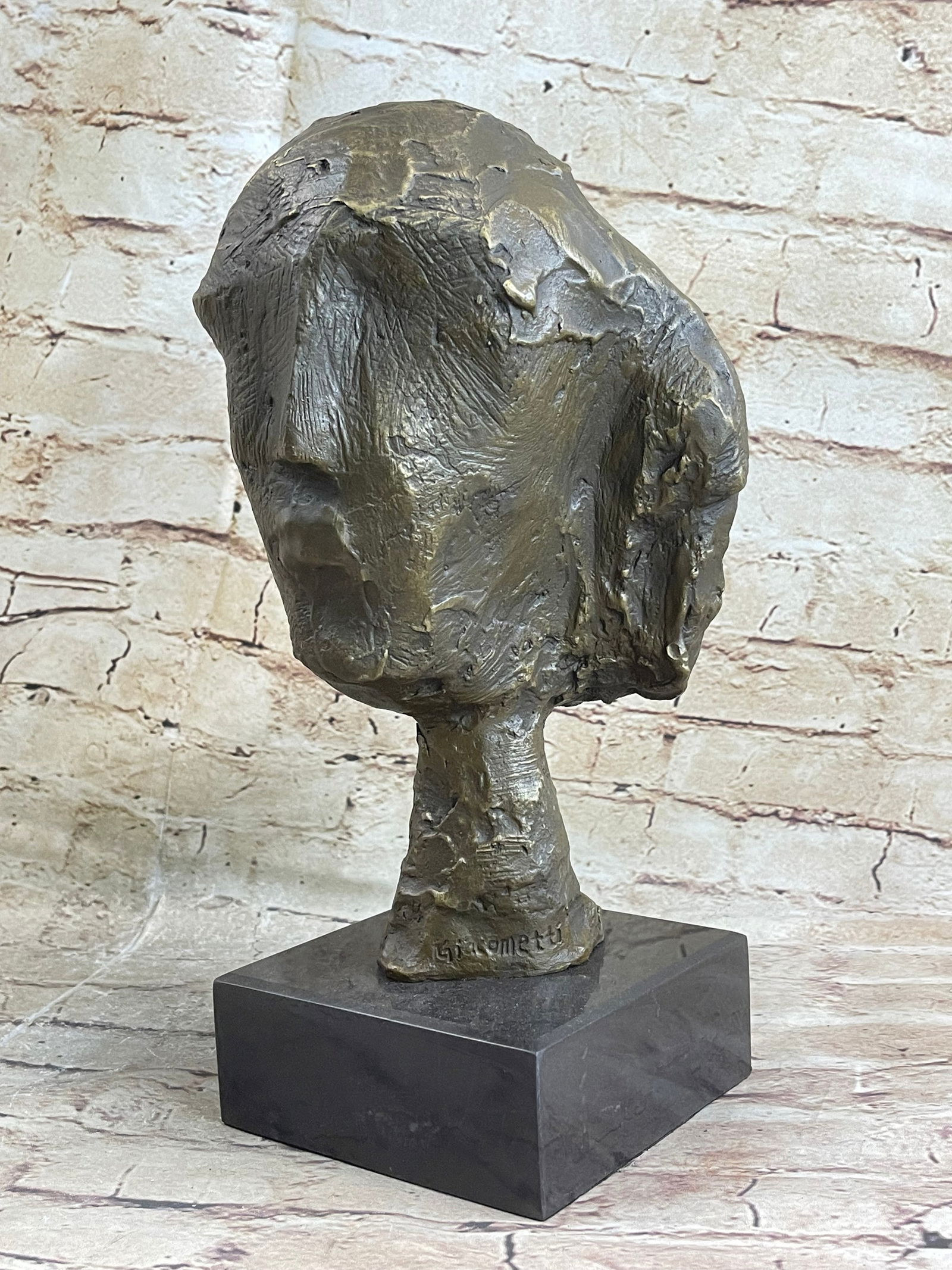 Head of a Woman by Alberto Giacometti Bronze Sculpture: Bronze Dimensions with Marble Base: Height 13" X Width 7"Marble Dimensions:5" X 5"Height without base:11"Weight:10 LBSOriginal or Reproduction: Reproduction