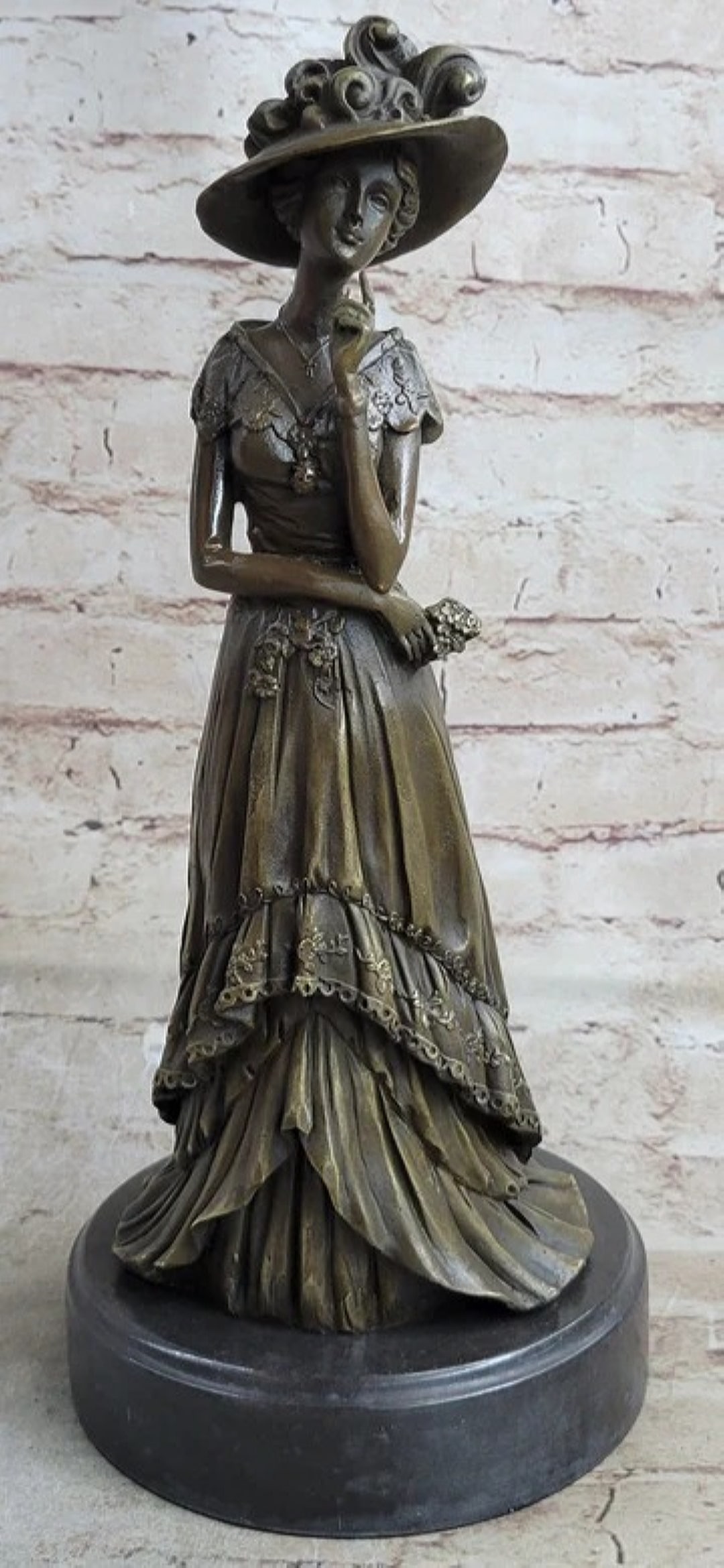Young Woman in Victorian Fashion Hat Bronze: Total Dimensions: Height 14.6'' x Width 6.5''Approximate Weight: 12 LBSOriginal Reproduction: Original