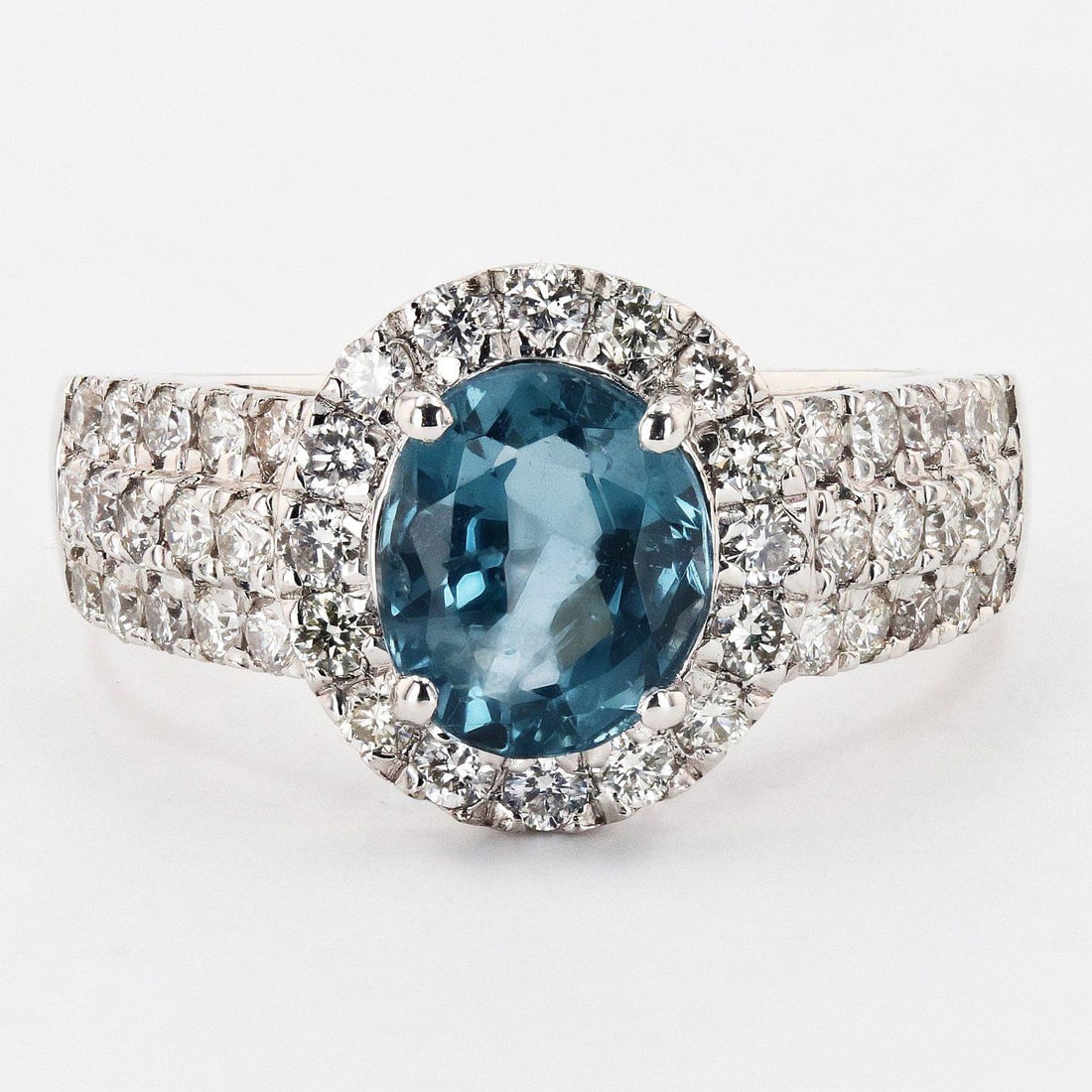 1.80ct UNHEATED Blue Spinel and 0.81ctw Diamond Platinum Ring (GIA CERTIFIED): One electronically tested platinum ladies cast spinel and diamond ring. Condition is new, good workmanship. The featured blue spinel is set within a diamond bezel, supported by diamond set tapering sh