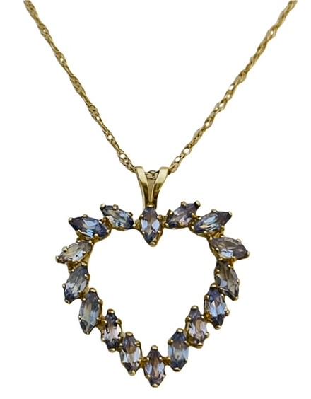 14k gold Tanzanite Necklace & Pendant: Very pretty and dainty. Perfect for that special person. Both chain & pendant are stamped. The chain is 18" long and the pendant is 7/8" long. It weighs 1.94 grams.