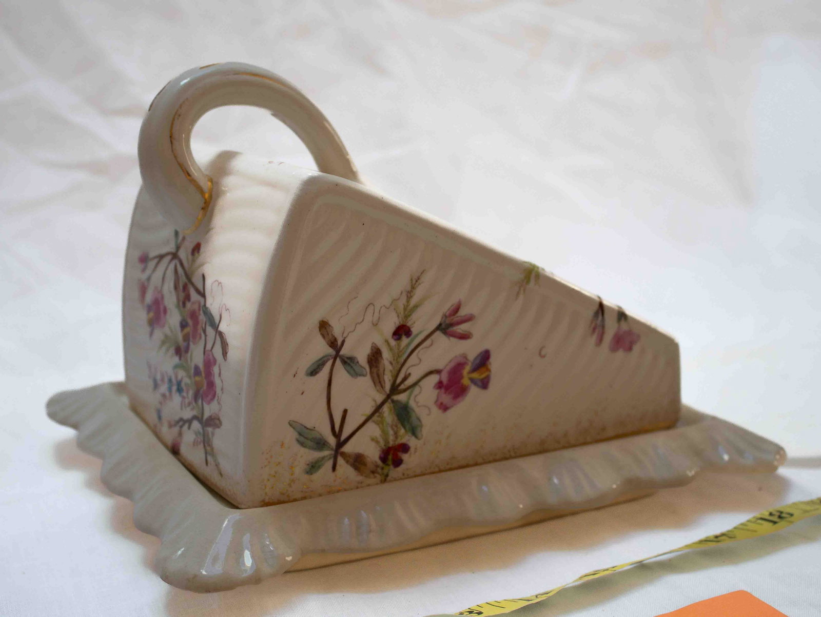 Porcelain Stilton Cheese Plate and Cover*: Plate shows discoloration from age and a small chip and ware to corner.