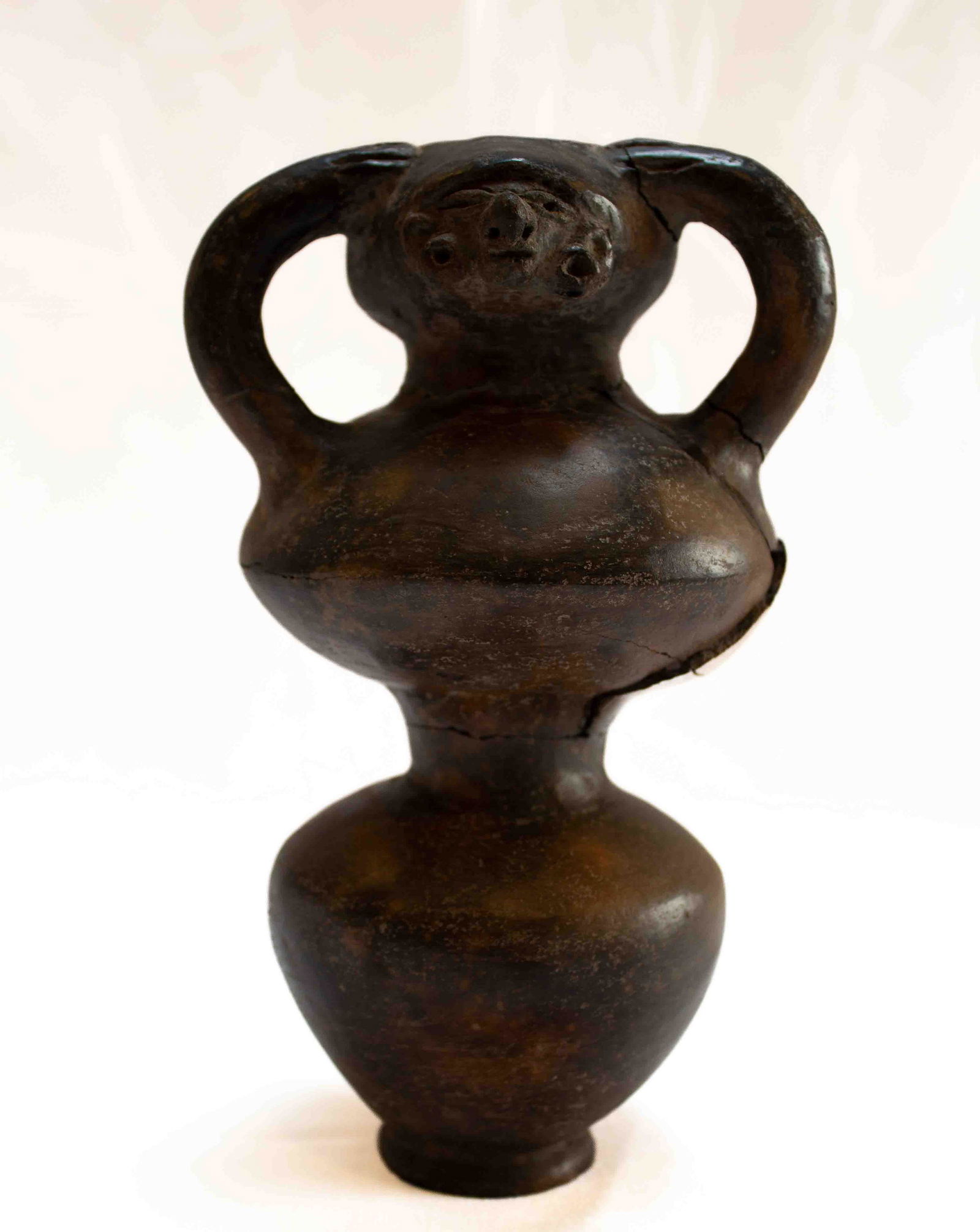 Archaeic Figural Vase w/ Base(repaired): Earthenware vase with repaired cracks to upper lobe and handle.