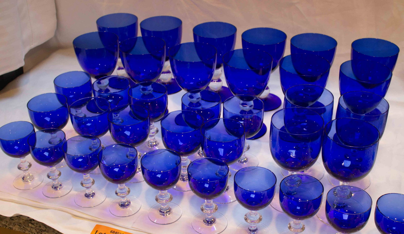 Colbalt Stemware: 12 Water Goblets, 1 Red wine Clear Stem, 10 White wine Clear Stem, 10 Champagne/Cordal Glasses